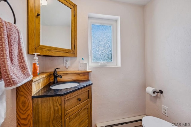 1139 Chickentown Rd, Somerset, PA 15501 - half bathroom with baseboard heating, vanity, and toilet