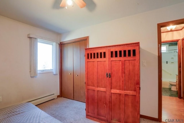 carpeted bedroom featuring a ceiling fan and a closet