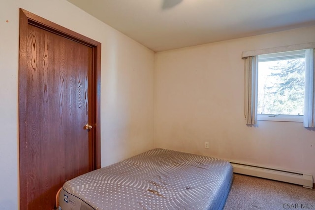 bedroom with a baseboard heating unit