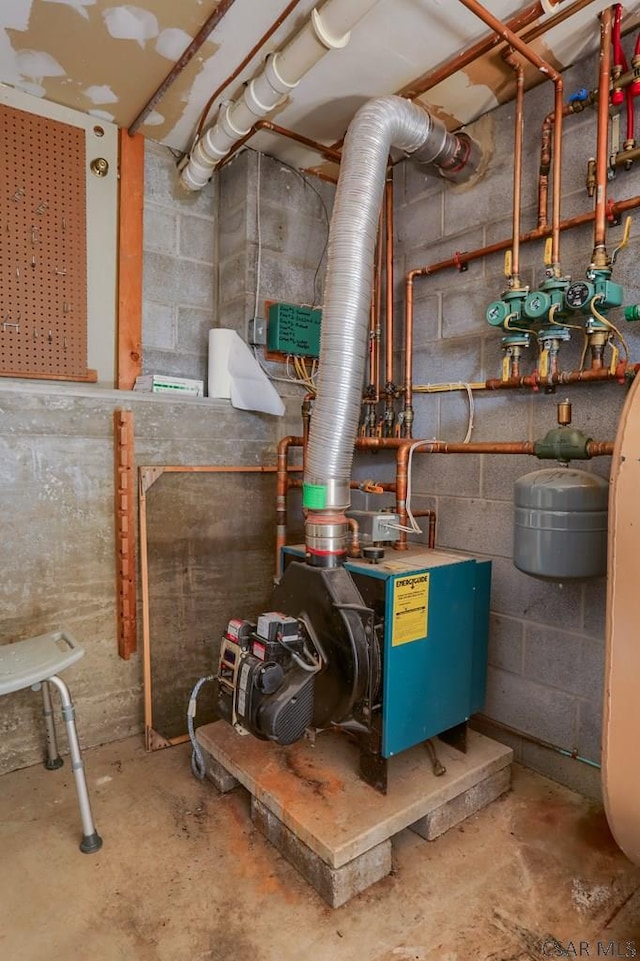 utility room featuring a heating unit