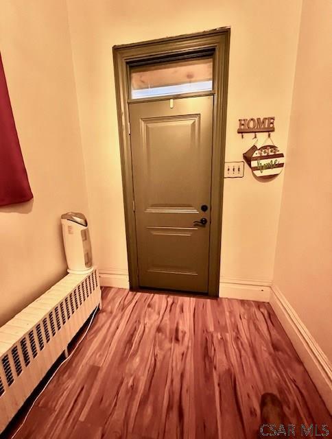 520 Highland Ave, Connellsville, PA 15425 - entryway with radiator heating unit and wood-type flooring
