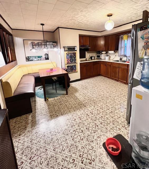 520 Highland Ave, Connellsville, PA 15425 - kitchen with stainless steel fridge, decorative light fixtures, and sink