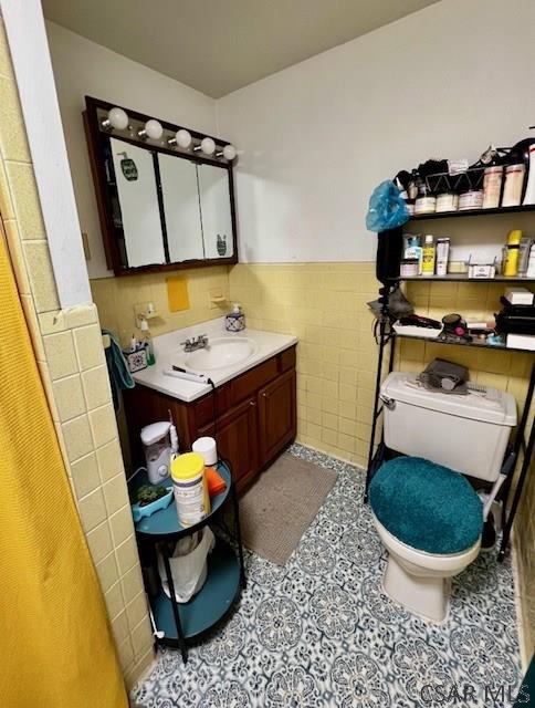 520 Highland Ave, Connellsville, PA 15425 - bathroom with tile walls, vanity, and toilet