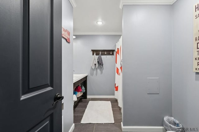 bathroom with tile patterned floors, baseboards, crown molding, and recessed lighting