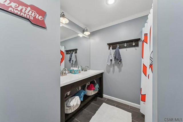 bathroom featuring baseboards, ornamental molding, vanity, and tile patterned floors