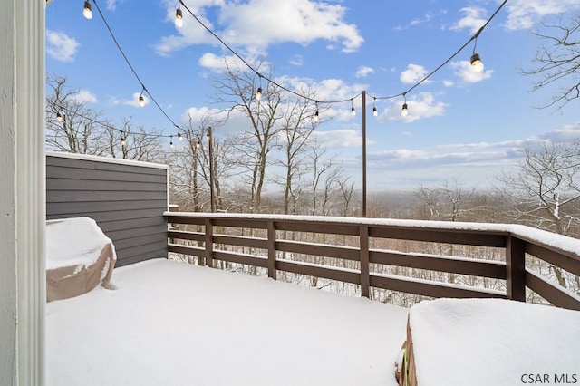 view of snow covered deck