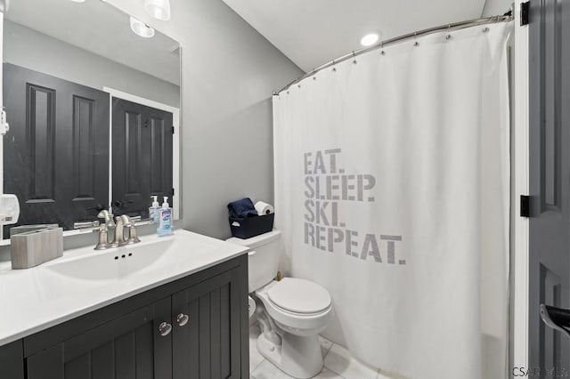 bathroom featuring toilet, tile patterned floors, and vanity