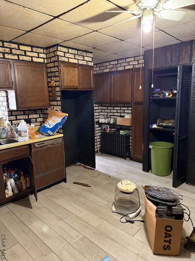 604-606 Grove Ave, Johnstown, PA 15902 - kitchen with a ceiling fan, a drop ceiling, light countertops, light wood-style flooring, and dark brown cabinetry