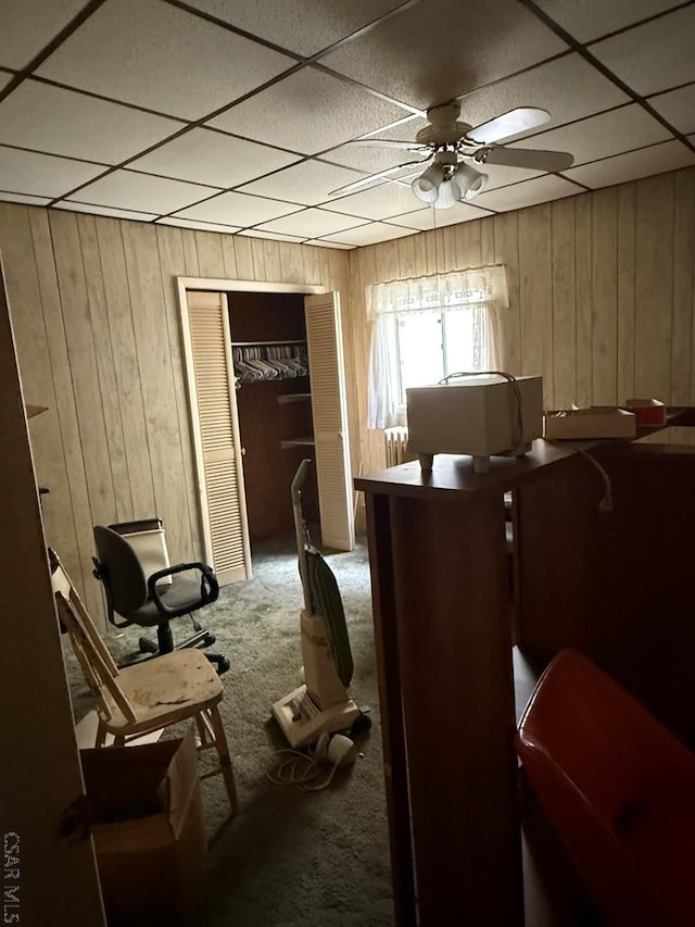 604-606 Grove Ave, Johnstown, PA 15902 - sitting room with carpet, wood walls, a paneled ceiling, and a ceiling fan