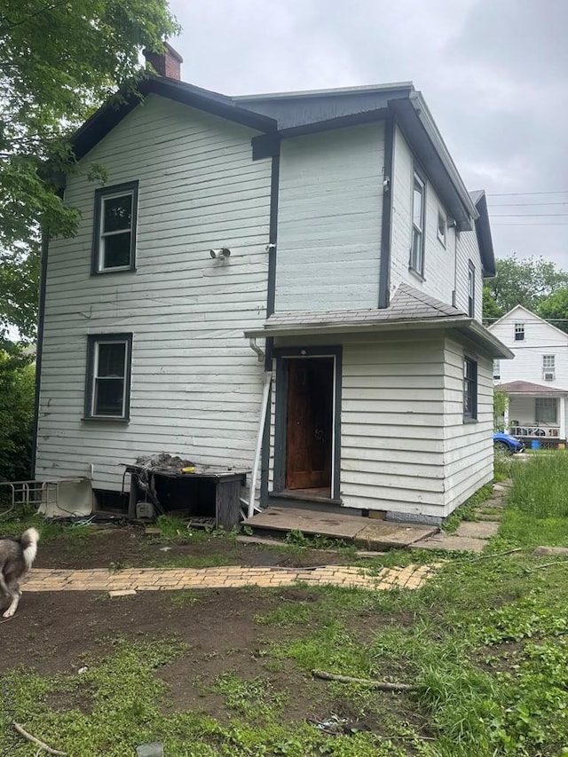 113 Sheridan St, Johnstown, PA 15906 - rear view of house featuring a chimney
