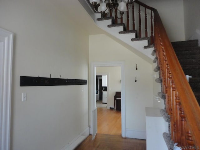 161 Ord St, Salisbury, PA 15558 - stairs featuring baseboards, a notable chandelier, and wood finished floors