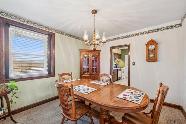 dining space featuring light carpet and a notable chandelier