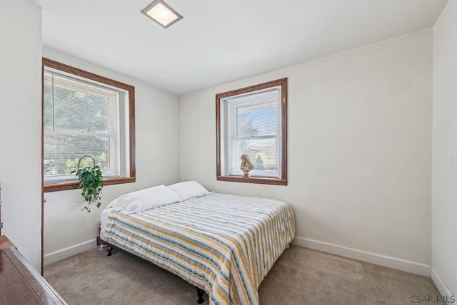 bedroom with light colored carpet