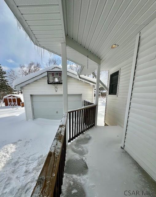 view of snow covered garage