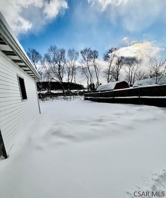 view of yard covered in snow