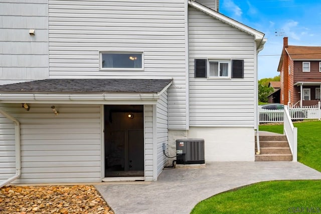 entrance to property featuring cooling unit and a patio area