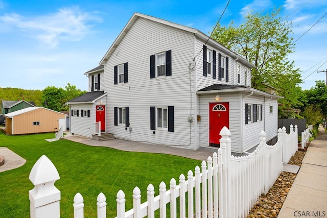 view of front of house featuring entry steps and an outdoor structure