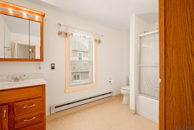 bathroom featuring baseboard heating, toilet, vanity, and combined bath / shower with glass door