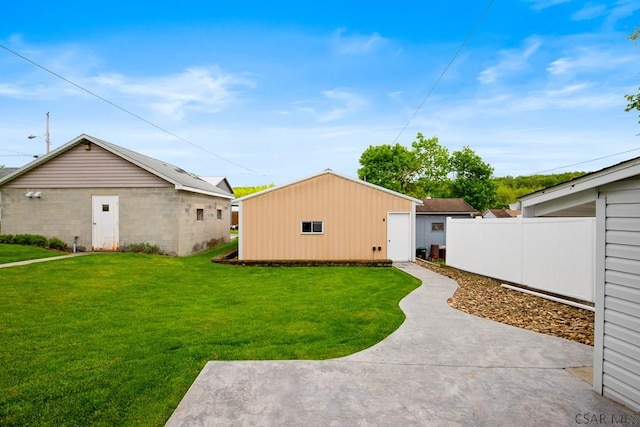 view of yard featuring an outbuilding and a patio