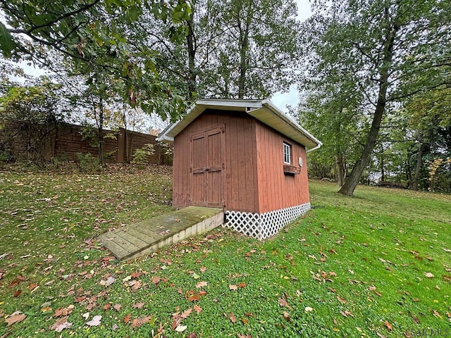 view of outdoor structure featuring a lawn