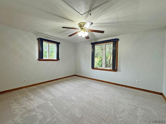 carpeted empty room with a wealth of natural light