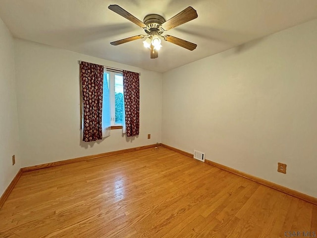 unfurnished room with ceiling fan and light hardwood / wood-style flooring