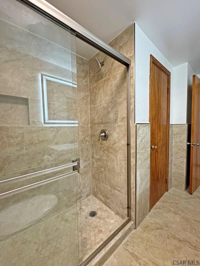 bathroom featuring an enclosed shower