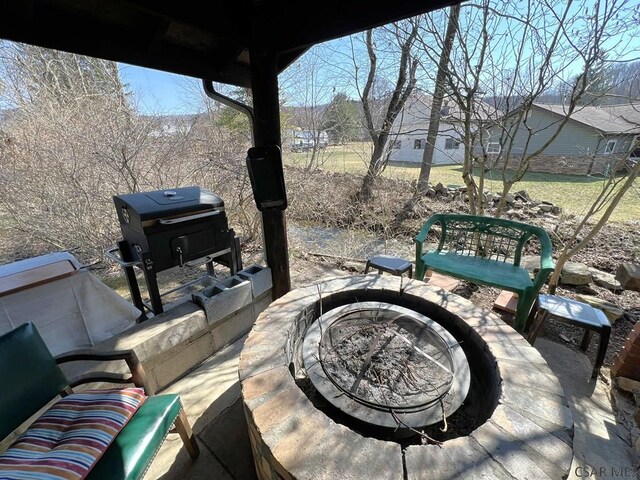 view of patio featuring a fire pit
