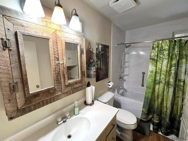 bathroom with vanity, shower / bath combination with curtain, toilet, ornamental molding, and wood finished floors