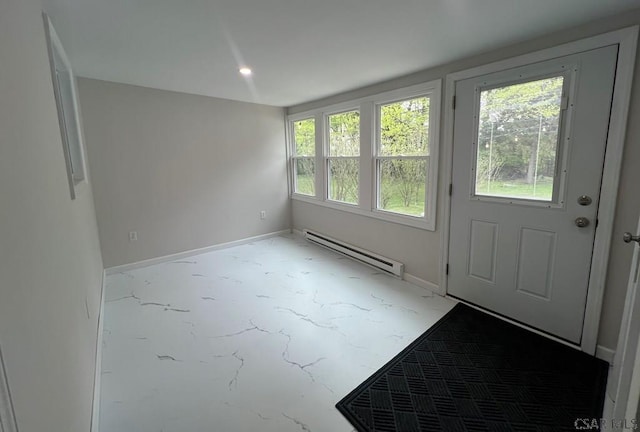 doorway with baseboards, concrete floors, plenty of natural light, and a baseboard heating unit