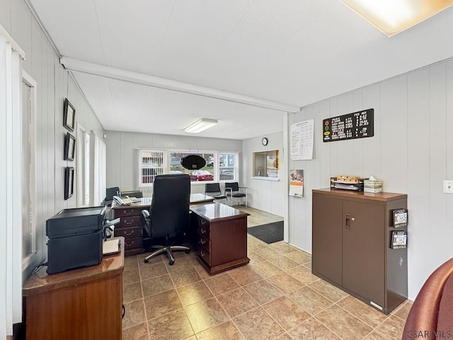 office area with wood walls