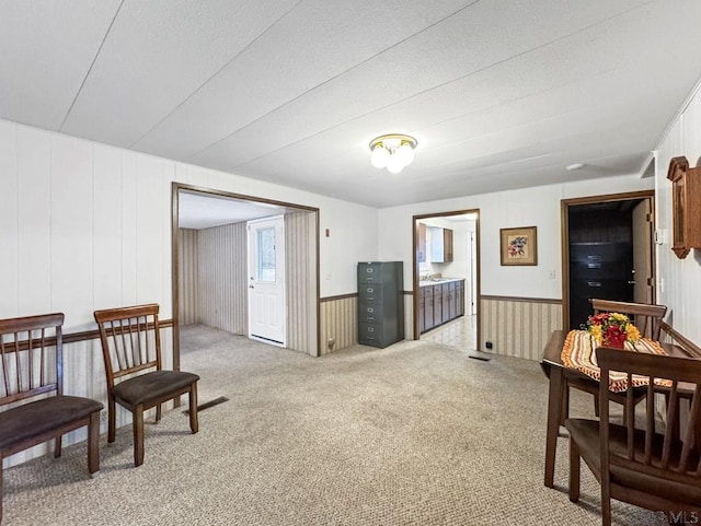 sitting room featuring carpet flooring