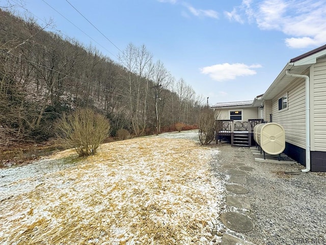 view of yard featuring a wooden deck