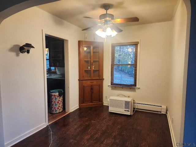 120 Northwood Ave, Johnstown, PA 15905 - unfurnished dining area featuring baseboard heating, wood finished floors, a ceiling fan, and arched walkways