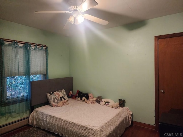 120 Northwood Ave, Johnstown, PA 15905 - bedroom with a baseboard heating unit, wood finished floors, ceiling fan, and baseboards