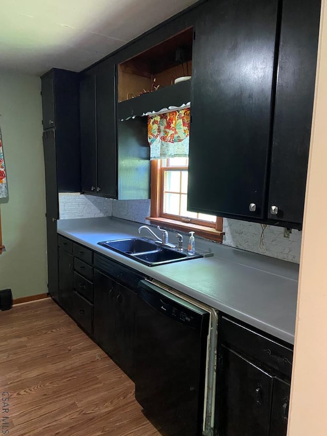 120 Northwood Ave, Johnstown, PA 15905 - kitchen featuring a sink, dishwasher, dark cabinetry, wood finished floors, and light countertops