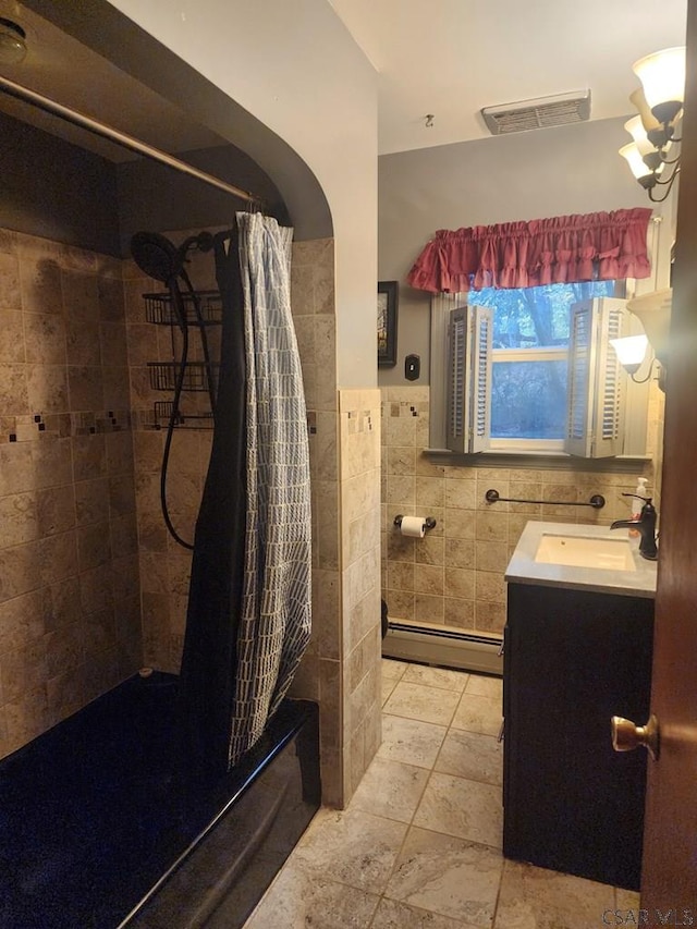 120 Northwood Ave, Johnstown, PA 15905 - full bathroom featuring tile walls, baseboard heating, a tile shower, and vanity