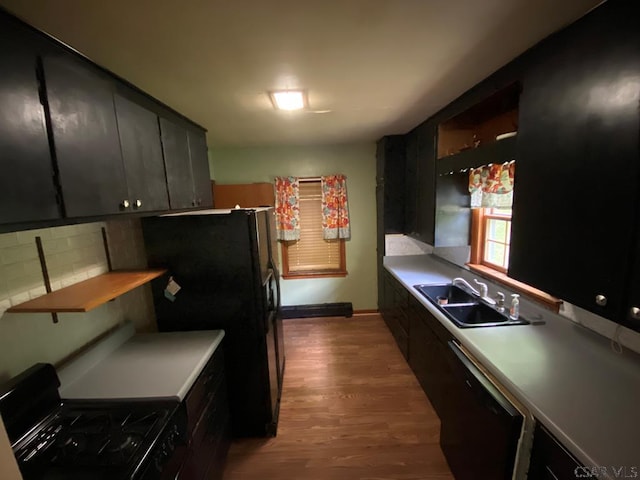 120 Northwood Ave, Johnstown, PA 15905 - kitchen with gas range, wood finished floors, dishwasher, and dark cabinetry