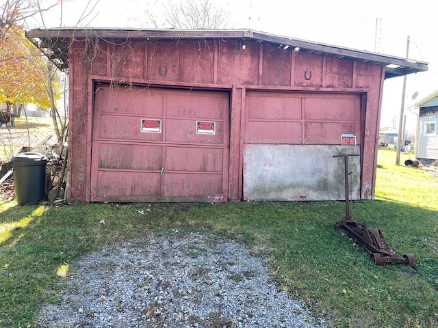 garage with a lawn