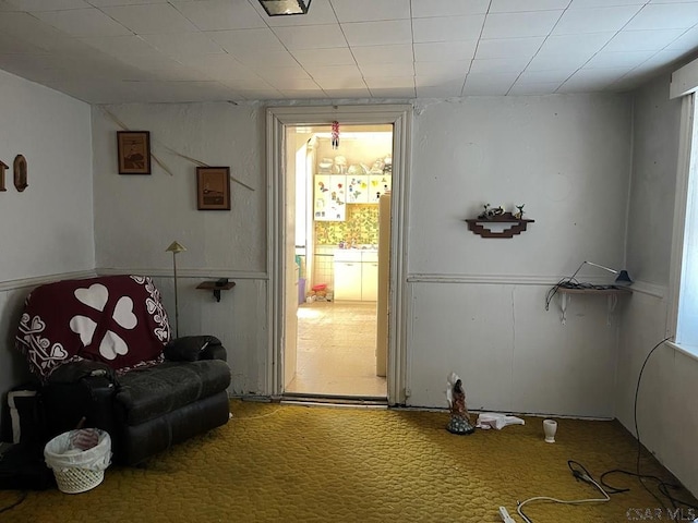 sitting room featuring carpet flooring