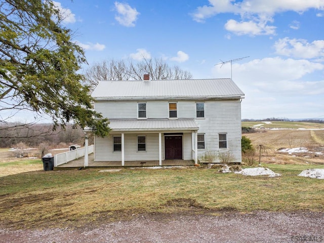 view of front of property with a porch and a front yard