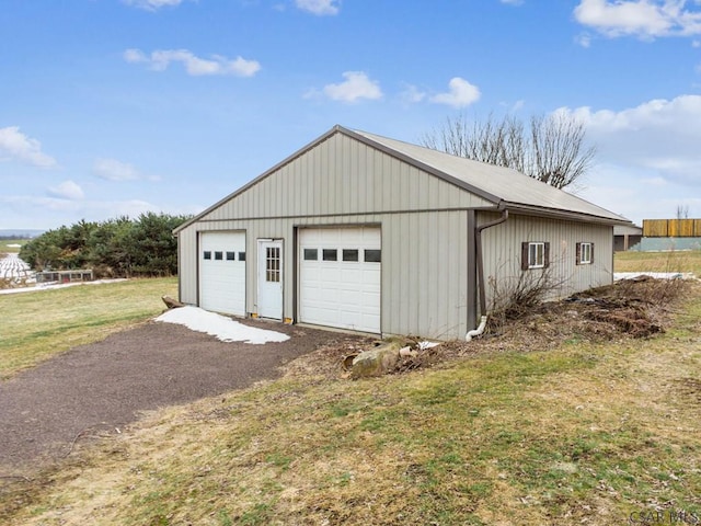 garage with a yard