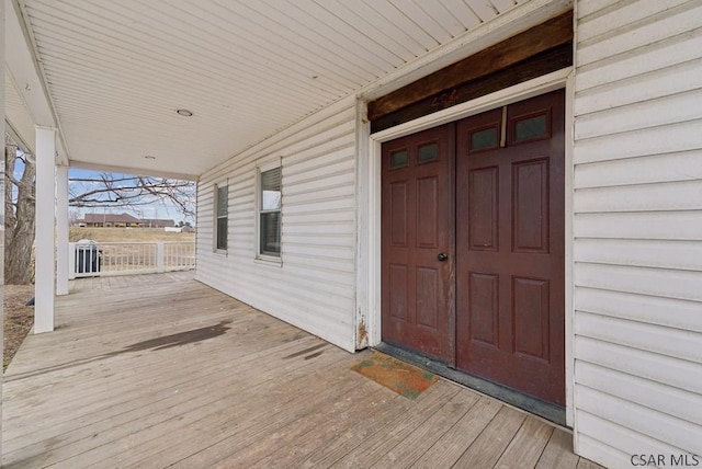 exterior space featuring cooling unit and covered porch