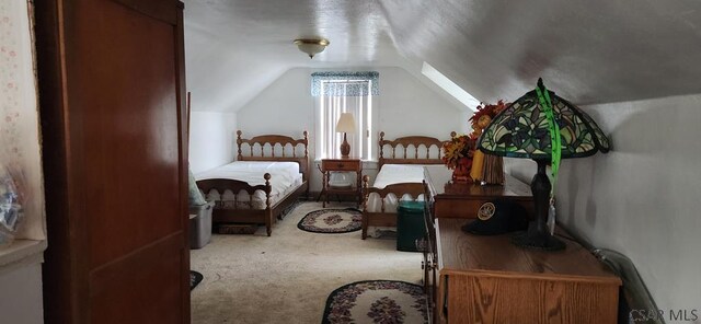 carpeted bedroom featuring lofted ceiling