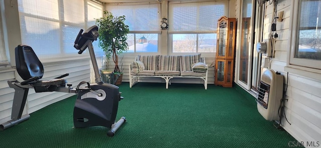 sunroom / solarium featuring heating unit