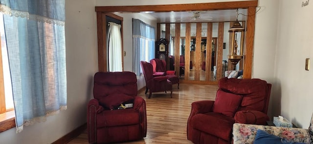 sitting room featuring ceiling fan and light hardwood / wood-style floors