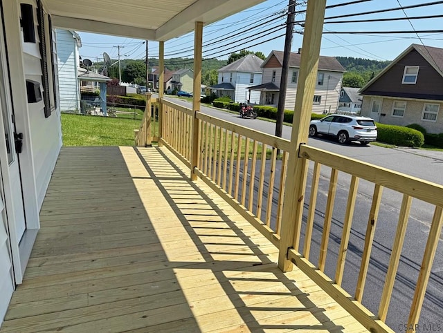 247 Jefferson Ave, Windber, PA 15963 - porch featuring a residential view and a lawn