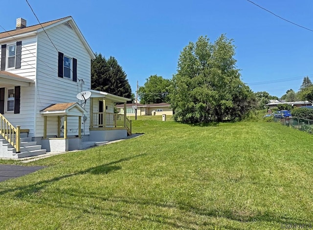 247 Jefferson Ave, Windber, PA 15963 - view of grassy yard featuring a porch