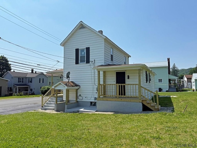 247 Jefferson Ave, Windber, PA 15963 - rear view of property with a yard and a chimney