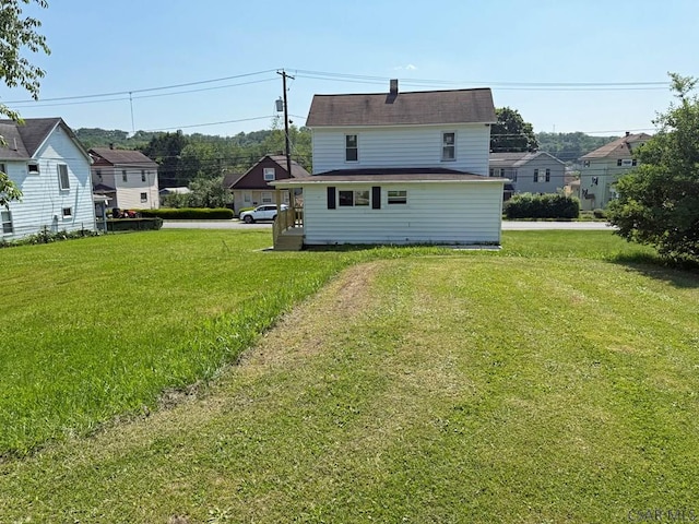 247 Jefferson Ave, Windber, PA 15963 - rear view of property featuring a yard